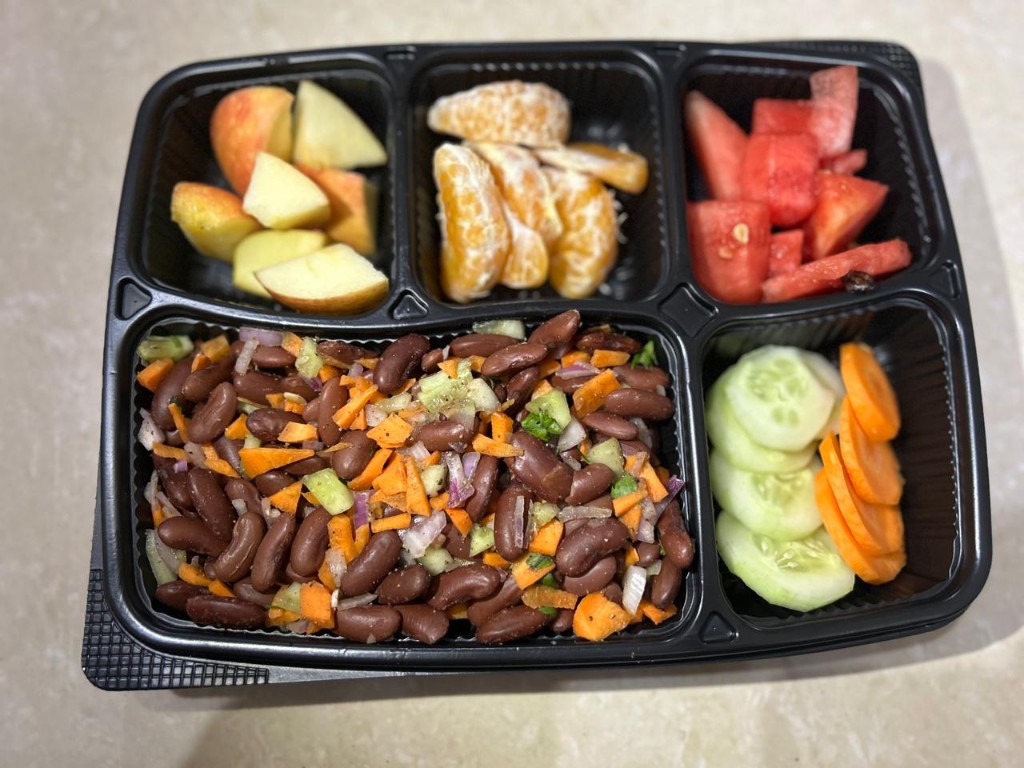 Bean salad with apple, citrus, watermelon, and vegetables