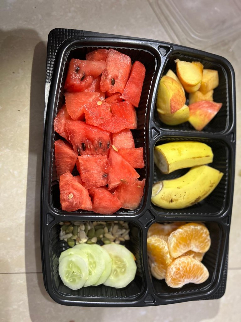 Watermelon, apple, banana, orange, cucumber, and seed mix