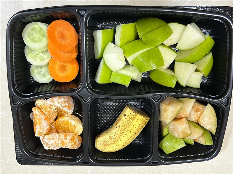 Sprout bowl with green apple, banana, vegetables, and longans