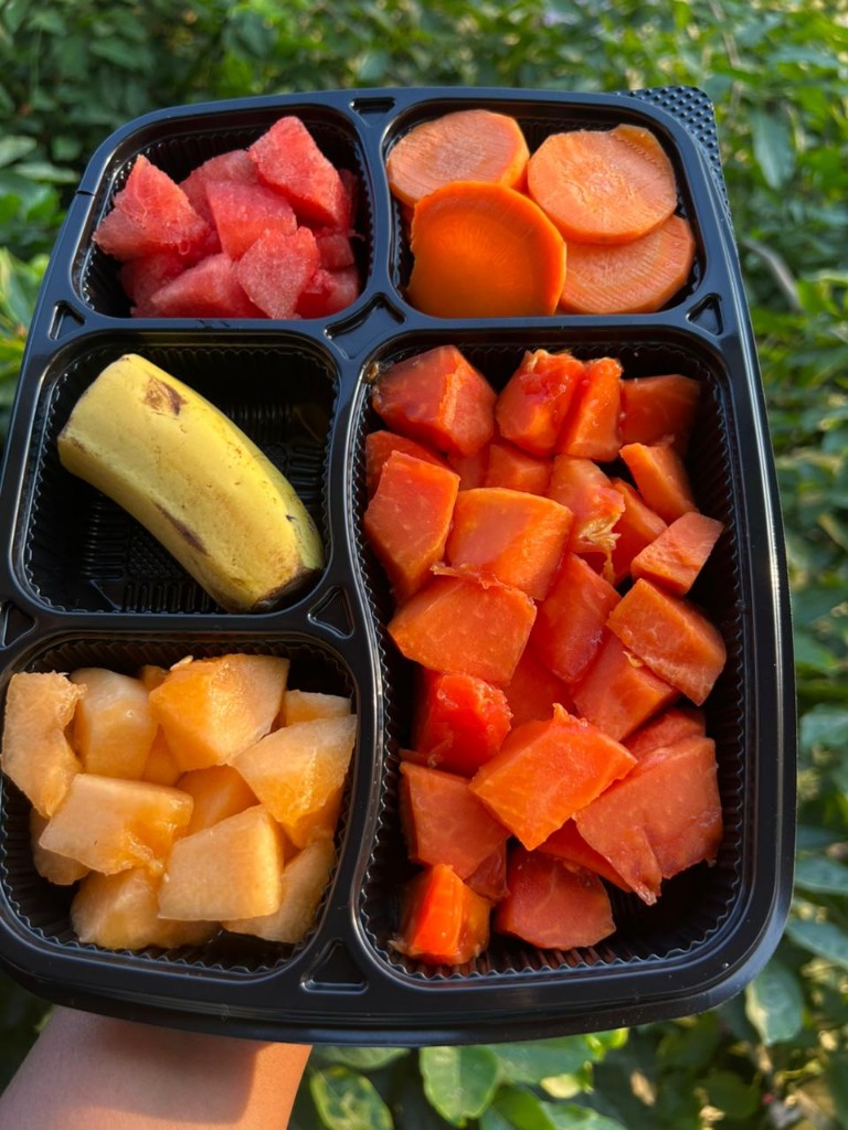 Tropical fruit box with watermelon, papaya, cantaloupe, and banana
