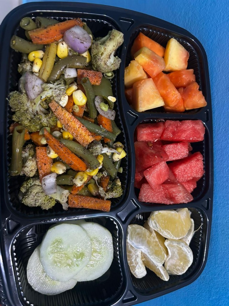 Roasted vegetables with papaya, watermelon, orange, and cucumber